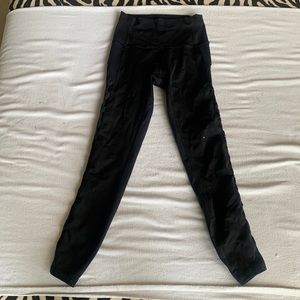 Lululemon Black Rhythm High Times Mesh side leggings.
